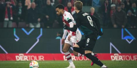 From left to right: Kenyan midfielder Linton Maina vies for the ball with a Werder Bremen player during a Bundesliga match on January 21, 2023, in Germany.
