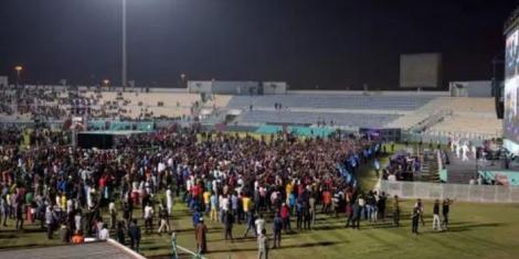 Migrant workers watch the Ecuador vs Qatar match in a special zone located in Doha on November 20, 2022.
