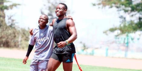 Ferdinand Omanyala hanging out with a kid on August 20, 2022 in Nairobi, Kenya.