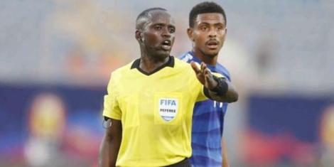 Kenyan referee Peter Waweru officiates a football match in the past.