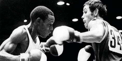 From left to right: Decorated boxer Philip Waruinge in action against his opponent in a past event.