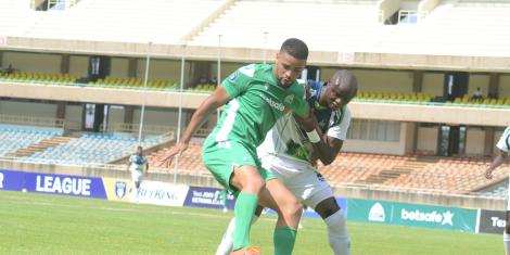 Gor Mahia forward Wilson Silva tussles for the ball with KCB's Denis Odhiambo