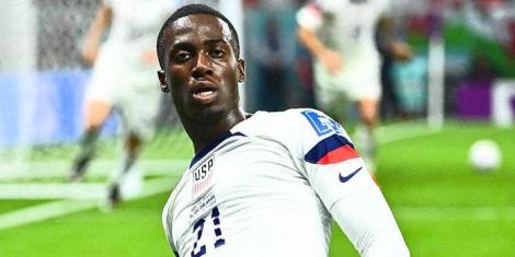 Timothy Weah celebrates scoring a goal for the United States at the 2022 FIFA World Cup on November 21in Qatar.