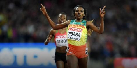 Ethiopian runner Tirunesh Dibaba crosses the finishing line at the 2017 World Championships in London.