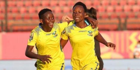 Vihiga Queens players Violet Wanyonyi (right) and Shikangwa Gentrix (left) celebrating a goal in a past match
