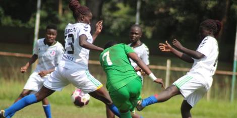 Vihiga Queens and Kangemi Ladies players vie for the ball during a Kenya Women's Premier League match staged at Mumias Complex on December 21, 2022.