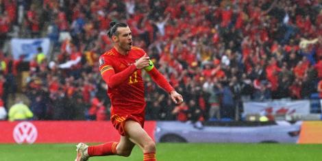 Wales international Gareth Bale cheers after Ukraine's own goal that brought an end to their 6 decade World Cup wait.