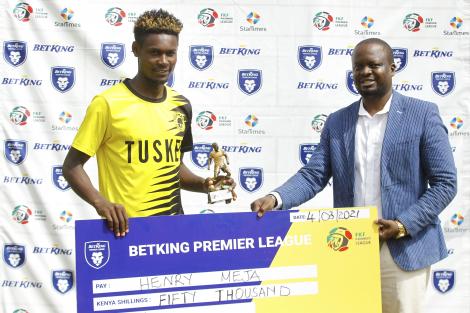 Henry Meja and SJAK Football Committee member James Waindi